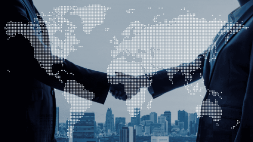 Two business people shaking hands.