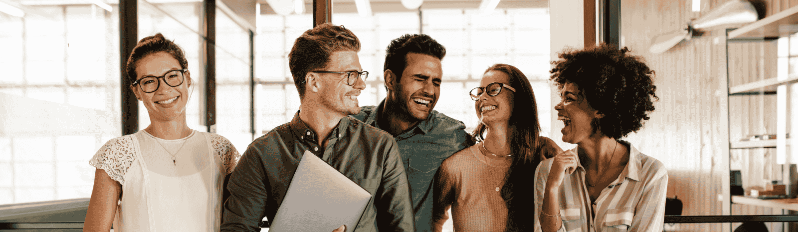 A group of people standing together in an office