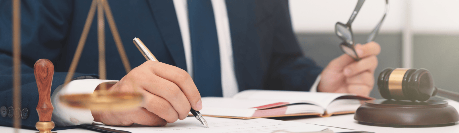 Lawyer or attorney working with papers in office. Law and justice concept.