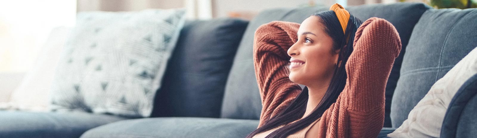 A lady relaxing in her living room